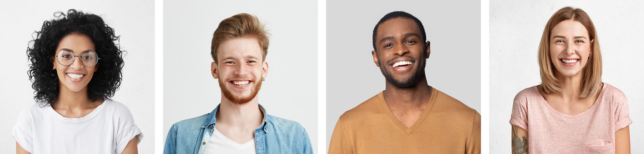 Four diverse, smiling people