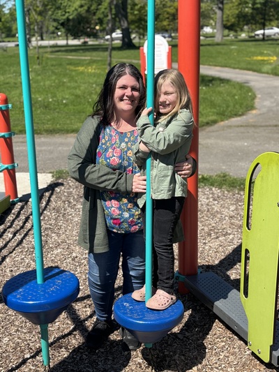 Hannah Parker and her daughter on a slide