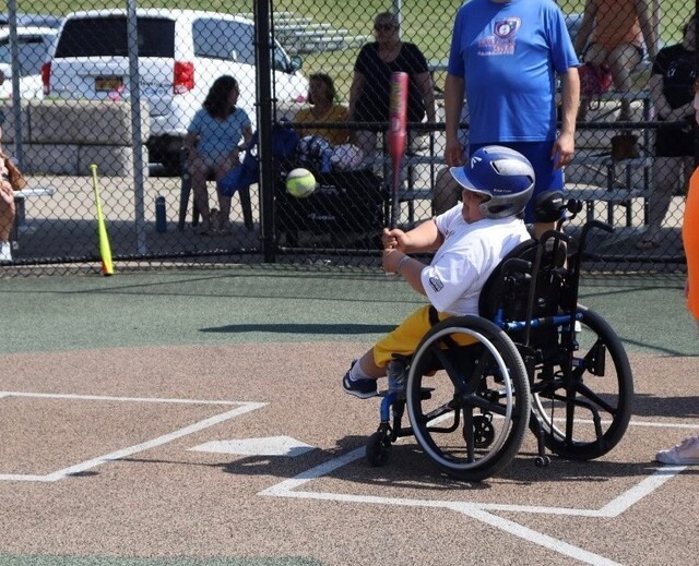 Liam hits the baseball
