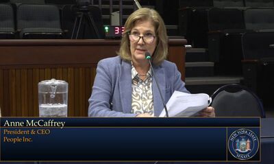Anne McCaffrey testifying in Albany