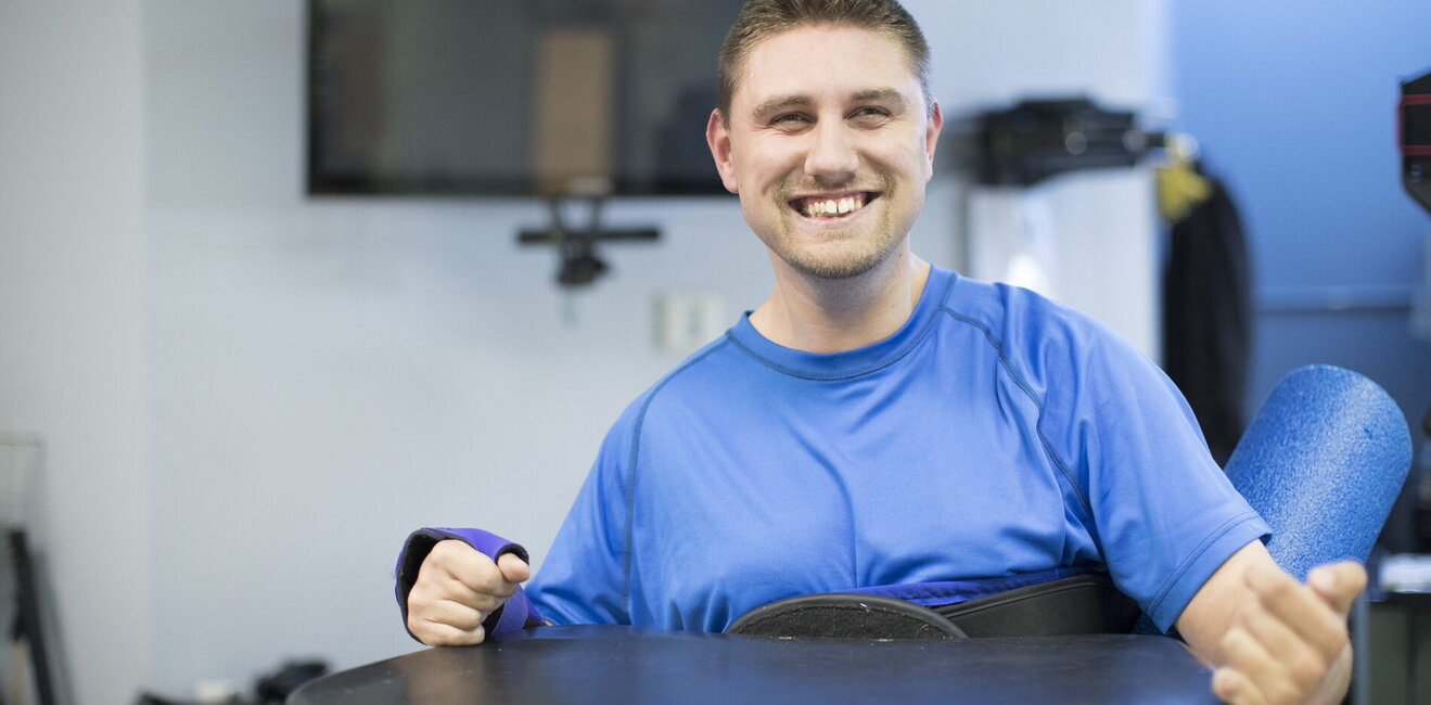 Young man smiling while working out