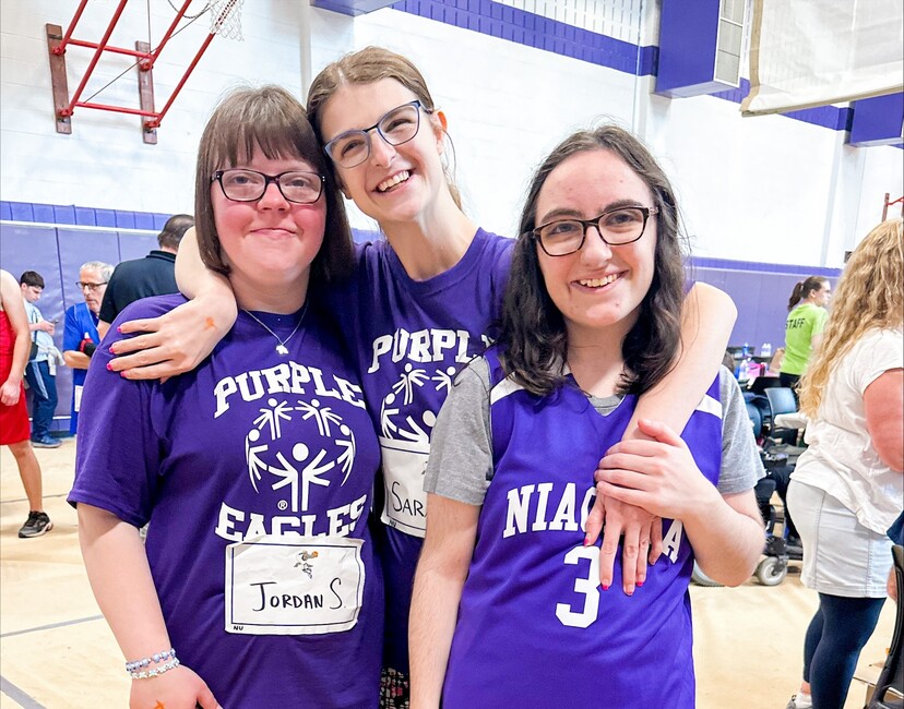 Athletes Smiling and Embracing