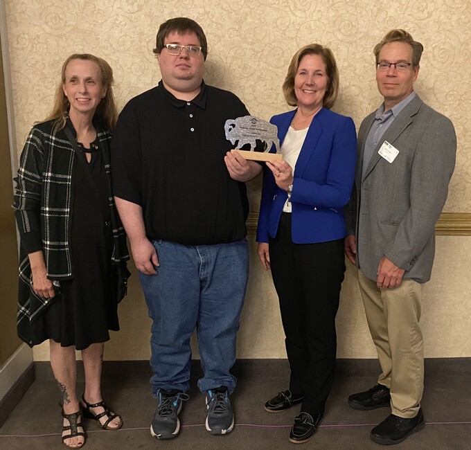 Teresa Oestereich, Jeremy Little, Anne McCaffrey and Ken Levan pose with Workforce Innovation and Training Award.