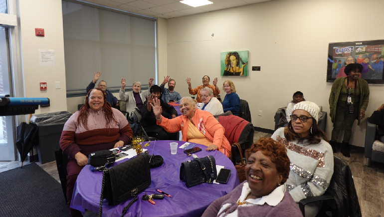 People waving to celebrate 100th birthday.