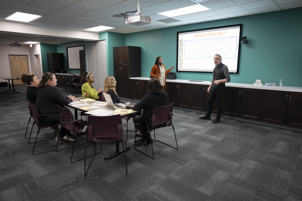 The large training room can also be divided in half .