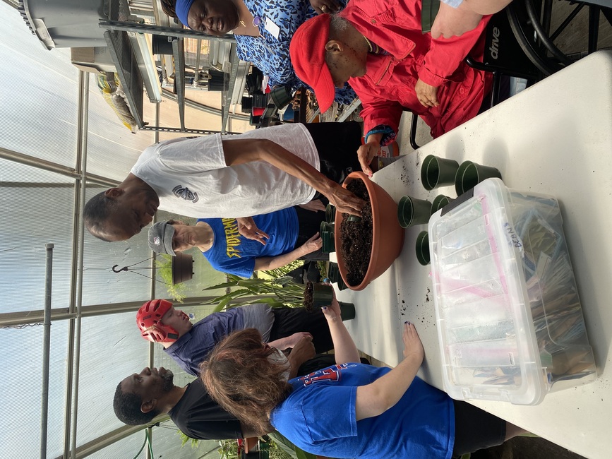 Planting class is in session.
